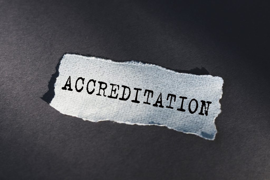 Piece of paper with the word accreditation typed onto it